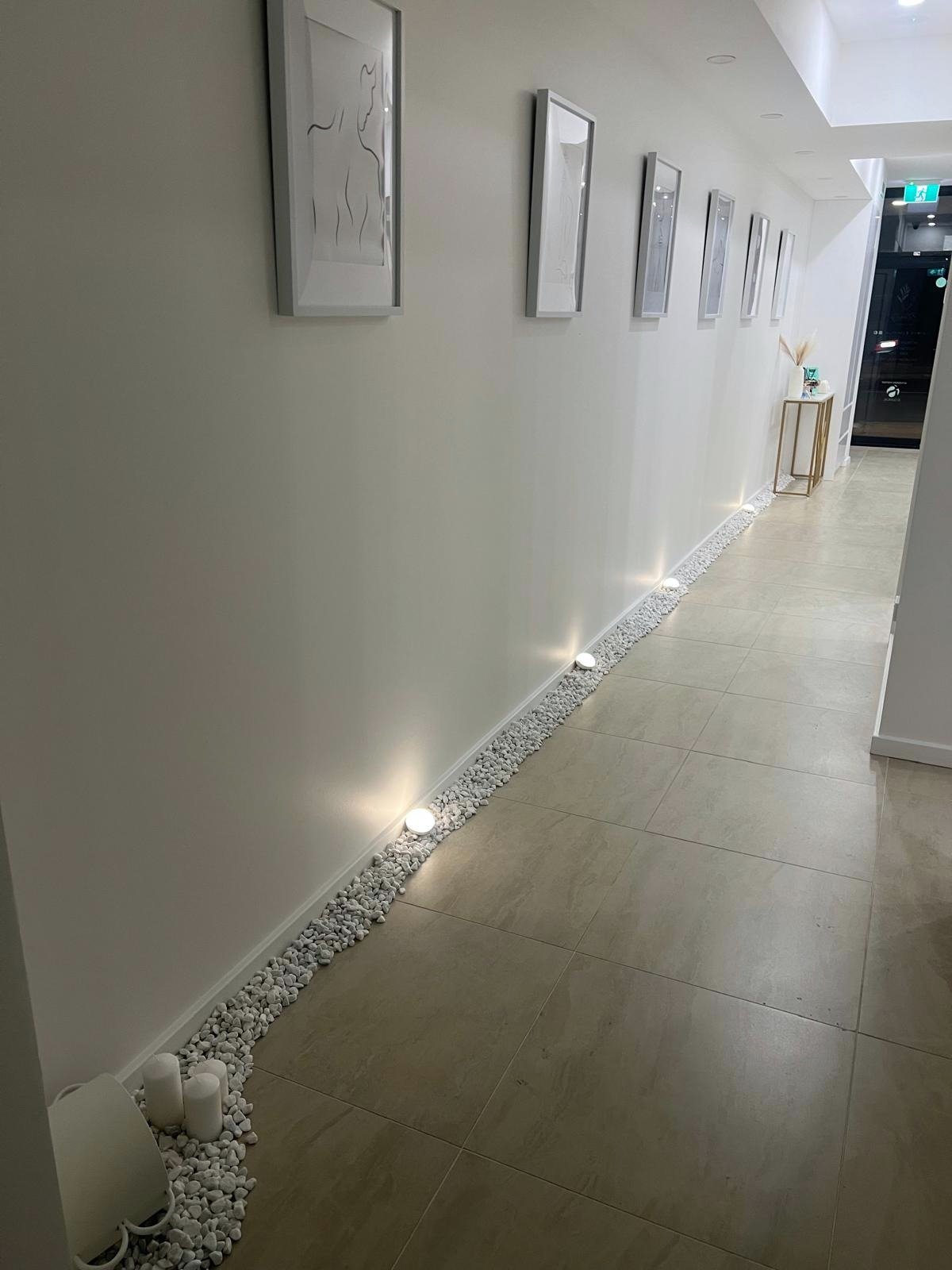 Interior hallway at Eternity Laser & Aesthetics Dural with warm uplighting