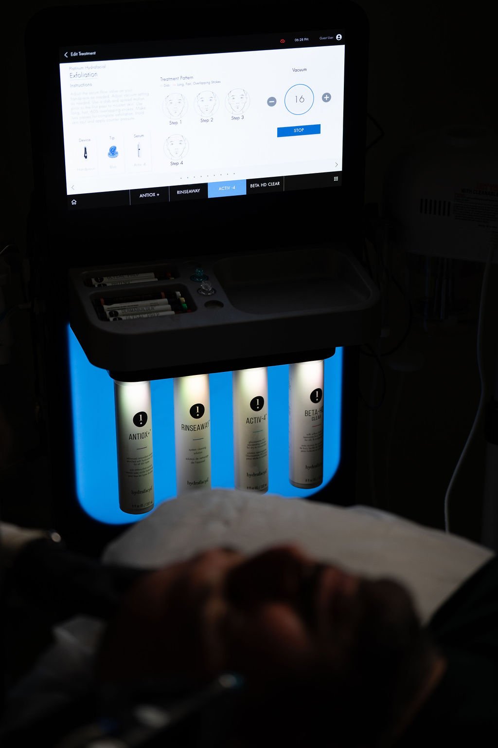 HydraFacial machine with blue-lit serums